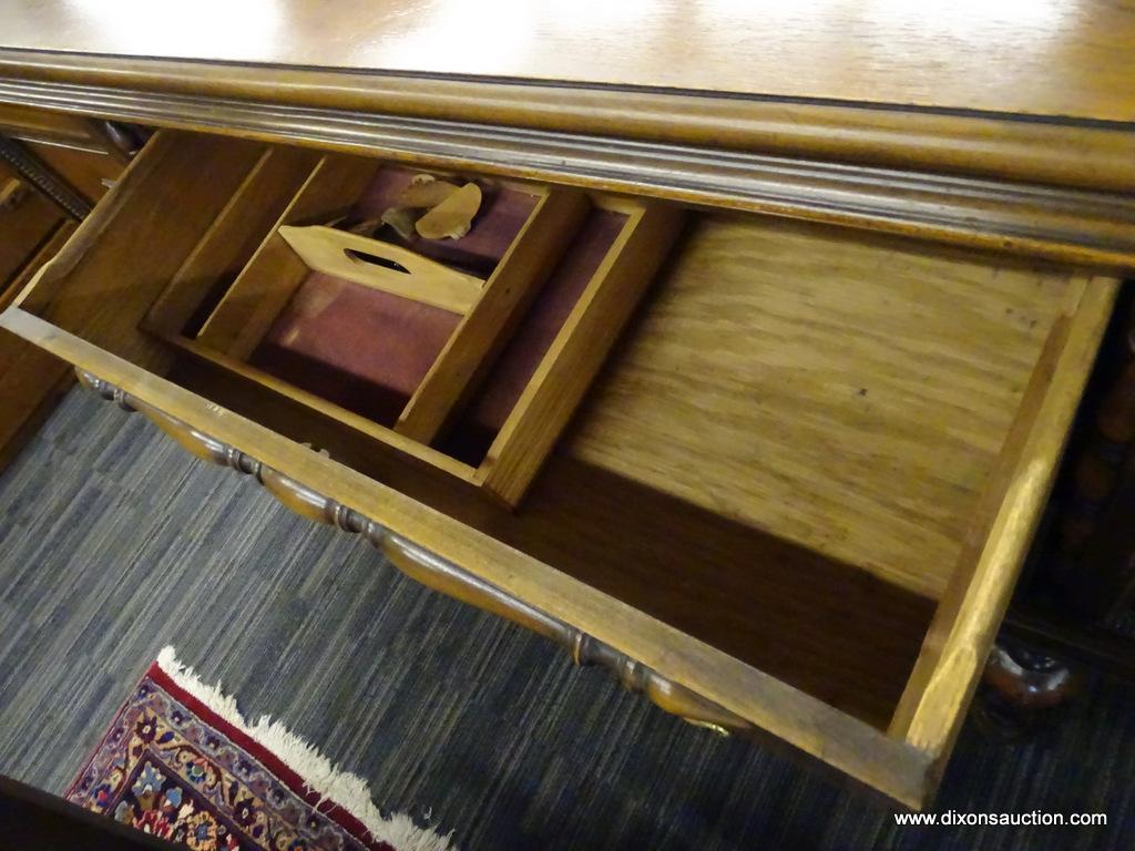 MAHOGANY END TABLE; MAHOGANY END TABLE WITH A BRACKETED BACKBOARD AND A ROUNDED EDGED TOP. HAS 2