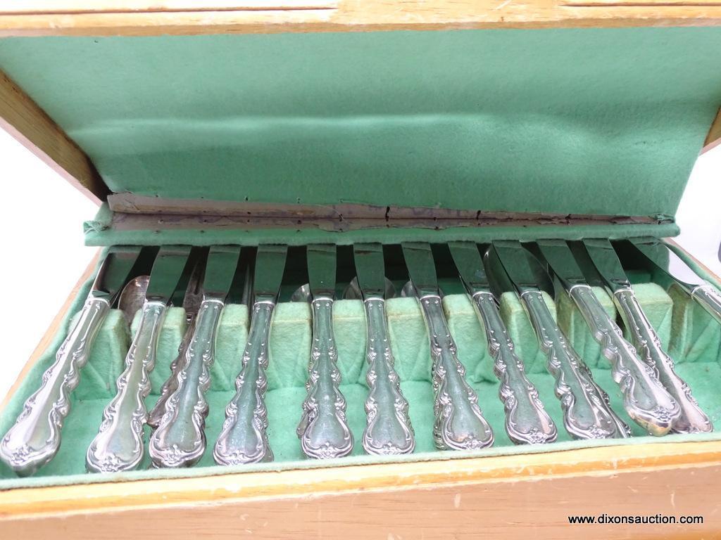 84 PIECES OF INTERNATIONAL STERLING FLATWARE; ANGELIQUE PATTERN. (12) STERLING HANDLED STAINLESS