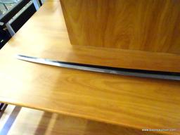 JAPANESE KATANA; SAMURAI SWORD WITH A WOODEN SHEATH COVERED IN BANDING. THE SWORD HAS A MAROON CLOTH