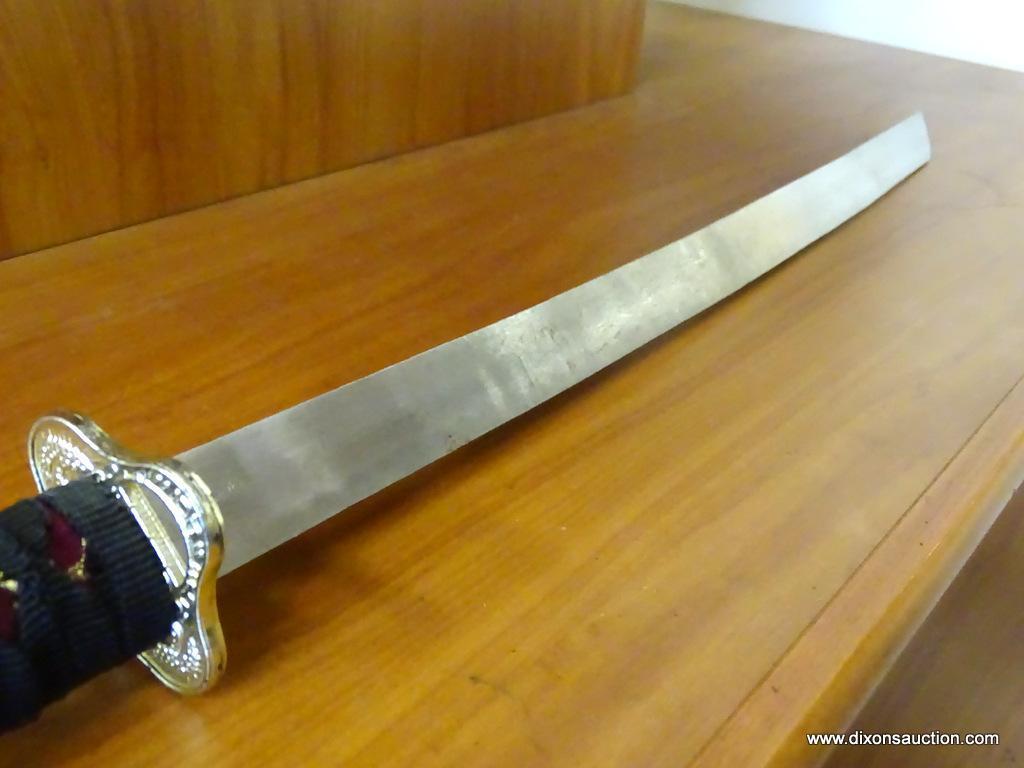 JAPANESE KATANA; SAMURAI SWORD WITH A WOODEN SHEATH ENVELOPED BY A PINK CLOTH WITH ORIENTAL GOLD