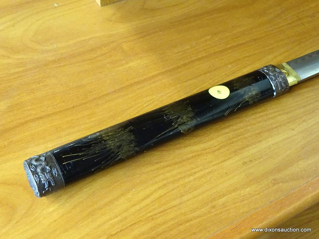 JAPANESE KATANA; JAPANESE SAMURAI SWORD WITH A BLACK WOODEN SHEATH THAT HAS BRONZE CAPS WITH DRAGONS