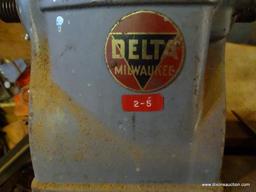 VINTAGE DELTA MILWAUKEE LATHE; DELTA LATHE THAT SITS ON A CUSTOM MADE BENCH WITH LOWER CABINETS.