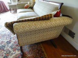 (FAM) ROLL ARM CAMELBACK SOFA; ANTIQUE CAMELBACK ROLL ARM SOFA WITH A BEIGE FLORAL FABRIC AND 4