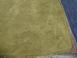 HAND KNOTTED AREA RUG; TAN HAND KNOTTED RUG WITH FRINGE DETAILING ALONG EACH SIDE. MEASURES APPROX.