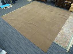 MACHINE MADE AREA RUG; LIGHT BROWN MEDIUM PILE AREA RUG. MEASURES APPROXIMATELY 14 FT X 14 FT.
