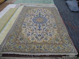 HAND KNOTTED AREA RUG; NEUTRAL TONE FLORAL AREA RUG IN CREAM, AND TAN WITH BLUE, ORANGE AND BROWN