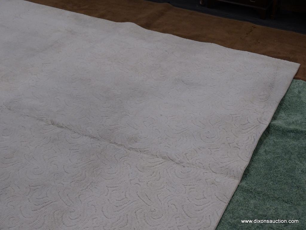 AREA RUG; OFF-WHITE MACHINE MADE AREA RUG WITH SWIRLING DESIGN. 100 % OLEFIN PILE. MEASURES