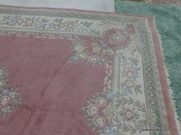 HAND KNOTTED RUG; PINK AND CREAM HAND KNOTTED RUG WITH BLUE, GREEN, AND ROSE COLORED FLOWERS. HAS