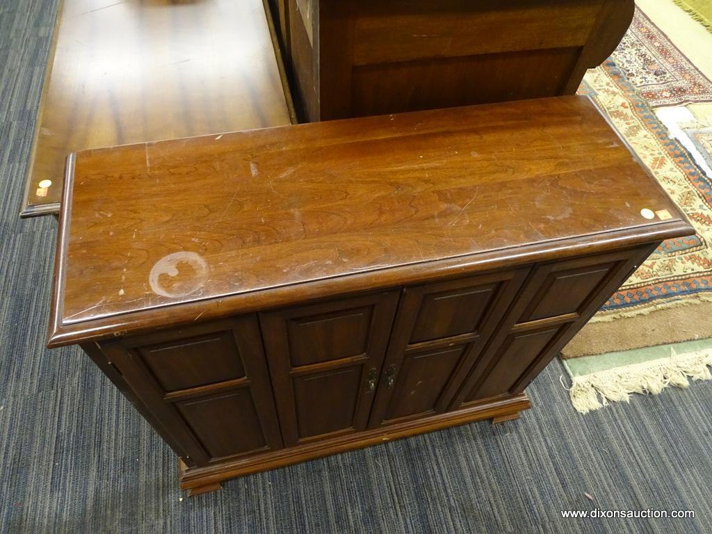 WOODEN CABINET; MAHOGANY CABINET WITH 2 BI-FOLD OPENING DOORS WITH METAL KNOBS THAT OPENS TO REVEAL