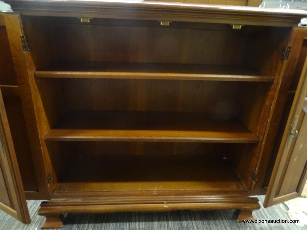 WOODEN CABINET; MAHOGANY CABINET WITH 2 BI-FOLD OPENING DOORS WITH METAL KNOBS THAT OPENS TO REVEAL