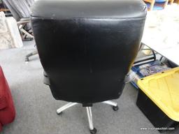 (R4) OFFICE CHAIR; FAUX BLACK LEATHER OFFICE CHAIR. HAS MINOR WEAR. MEASURES 26 IN X 26 IN X 50 IN.