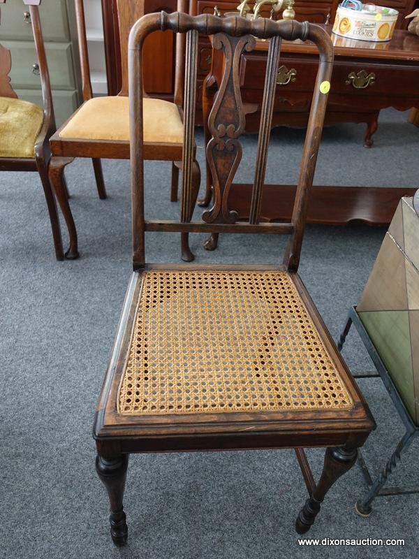 (R4) VINTAGE CHAIR; WALNUT STAINED CANE BOTTOM CHAIR WITH CARVED SPLAT. HAS BEEN REFINISHED.