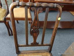 (R4) VINTAGE CHAIR; WALNUT STAINED CANE BOTTOM CHAIR WITH CARVED SPLAT. HAS BEEN REFINISHED.