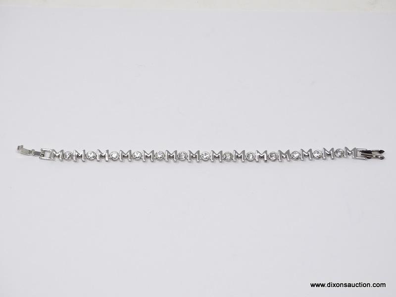 (SHOW) MOM TENNIS BRACELET; SILVER TONE TENNIS BRACELET, SAYS MOM CONTINOUSLY WITH ROUND CZ STONES