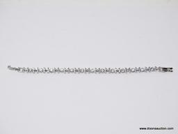 (SHOW) MOM TENNIS BRACELET; SILVER TONE TENNIS BRACELET, SAYS MOM CONTINOUSLY WITH ROUND CZ STONES