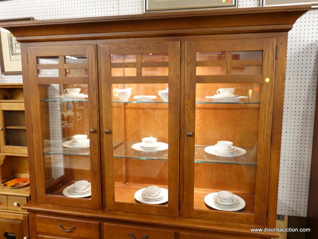 (R1) CHINA CABINET; 2 PIECE CHINA CABINET. TOP PIECE HAS 3 FRONT GLASS DOORS THAT OPEN TO REVEAL 2