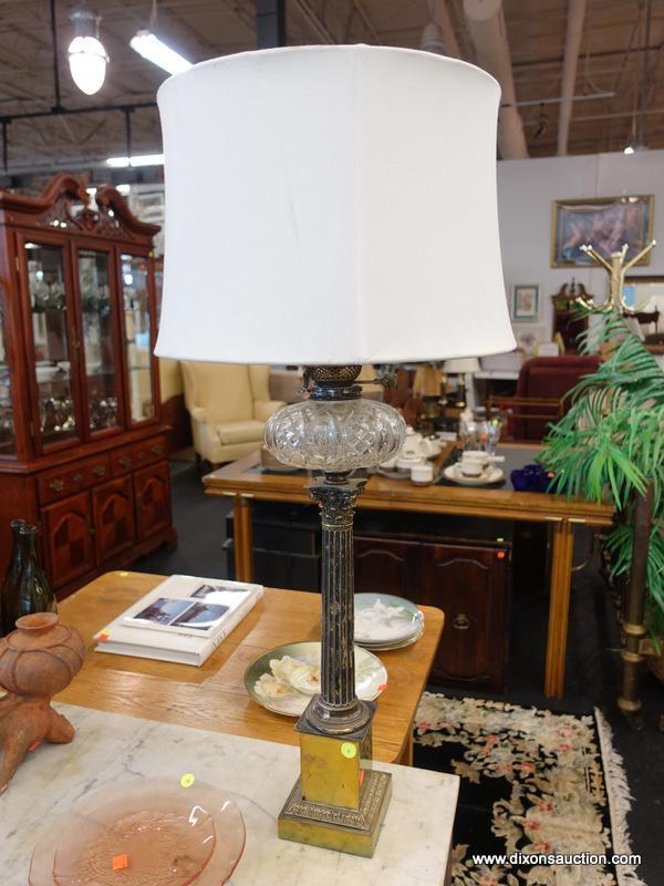 (R1) TABLE LAMP; VINTAGE OIL LAMP CONVERTED TO ELECTRIC WITH A COLUMN SHAPED STEM SITTING ON A GOLD