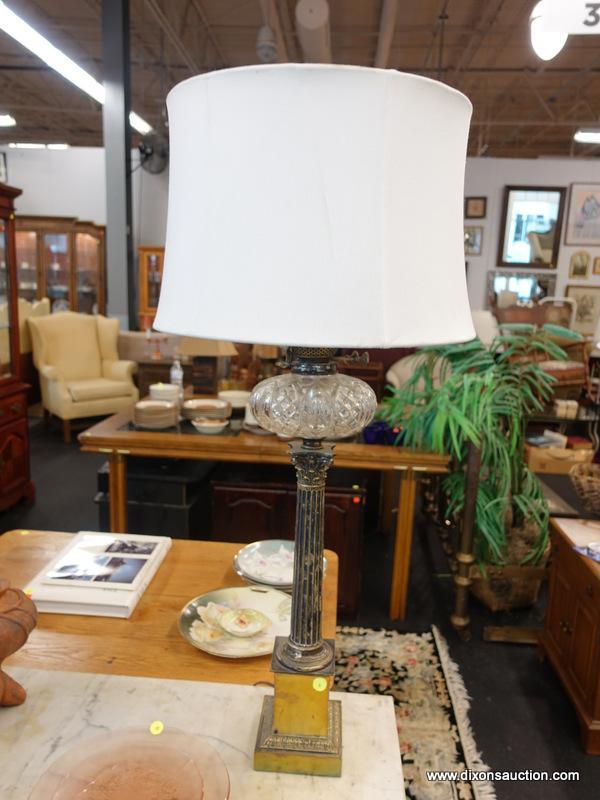 (R1) TABLE LAMP; VINTAGE OIL LAMP CONVERTED TO ELECTRIC WITH A COLUMN SHAPED STEM SITTING ON A GOLD