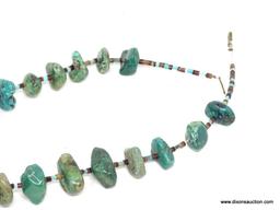 TURQUOISE AND SHELL NECKLACE; 29 IN LONG NECKLACE WITH LARGE STONES AND AN ADDITIONAL 6 IN LONG