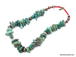 TURQUOISE NECKLACE; MEDIUM STONE TURQUOISE NECKLACE WITH RED BEAD DETAILING AND ROUND SILVER TONE