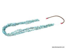 TRIPLE STRAND TURQUOISE NECKLACE; SMALL TURQUOISE STONES SEPARATED BY WHITE PUKA SHELLS, WITH RED