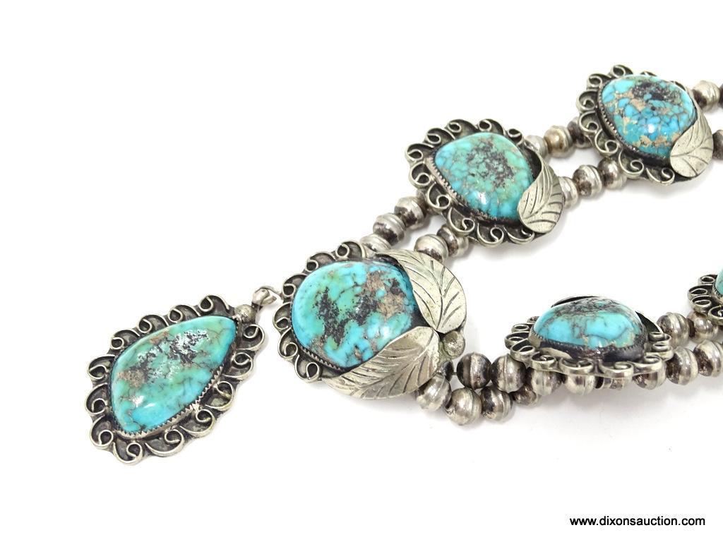 STERLING SILVER AND TURQUOISE NECKLACE; HANDMADE SQUASH BLOSSOM SILVER AND TURQUOISE NECKLACE WITH