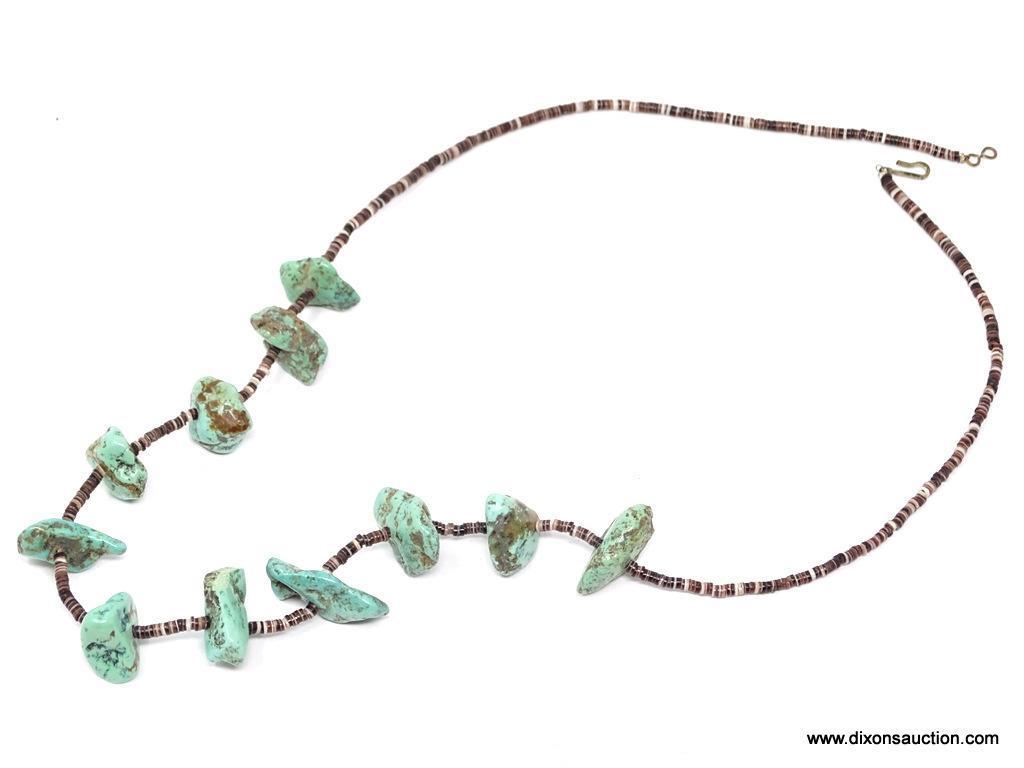 TURQUOISE AND PUKA SHELL NECKLACE; MEDIUM SIZE TURQUOISE STONES SEPARATED BY SMALL DARK PUKA SHELLS.
