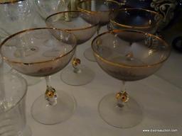 (LR) SHELF LOT OF STEMWARE; LOT CONTAINS 4 ETCHED COLORED MATCHING CHAMPAGNE FLUTES, 5 AMETHYST AND