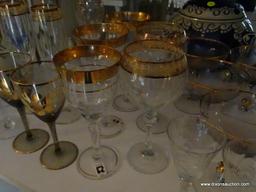 (LR) SHELF LOT OF STEMWARE; LOT CONTAINS 4 ETCHED COLORED MATCHING CHAMPAGNE FLUTES, 5 AMETHYST AND