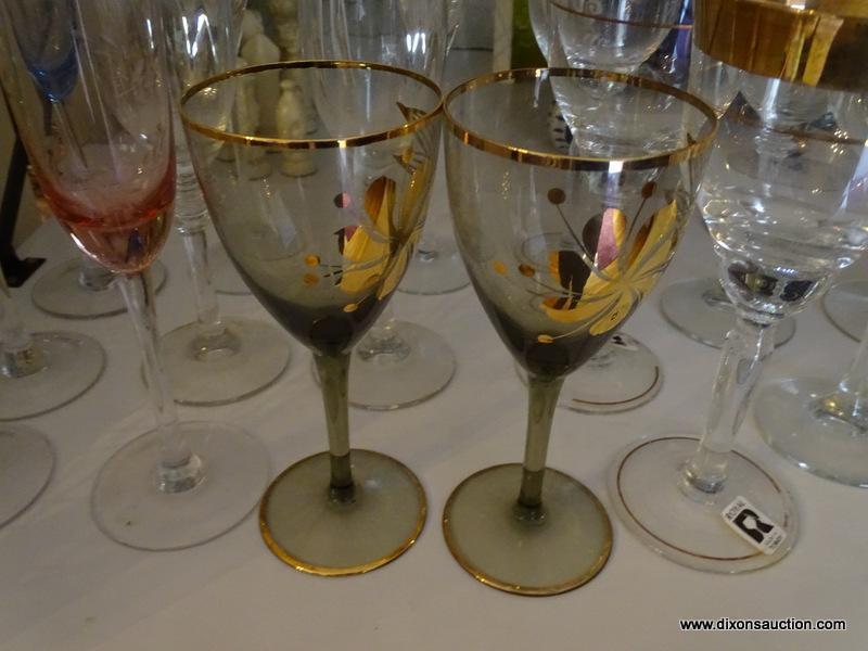 (LR) SHELF LOT OF STEMWARE; LOT CONTAINS 4 ETCHED COLORED MATCHING CHAMPAGNE FLUTES, 5 AMETHYST AND