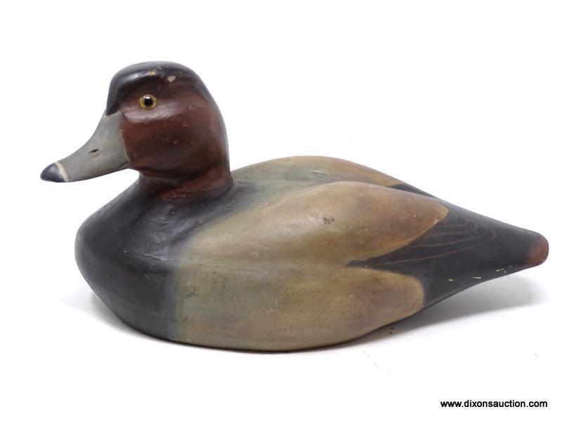 SOLID BODY REDHEAD DRAKE DECOY. GLASS EYES. ORIGINAL PAINT. ICE GROOVE IN THE BACK. AVERAGE WEAR.