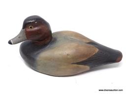 SOLID BODY REDHEAD DRAKE DECOY. GLASS EYES. ORIGINAL PAINT. ICE GROOVE IN THE BACK. AVERAGE WEAR.