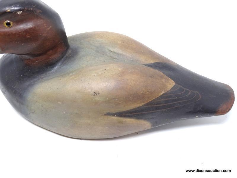 SOLID BODY REDHEAD DRAKE DECOY. GLASS EYES. ORIGINAL PAINT. ICE GROOVE IN THE BACK. AVERAGE WEAR.