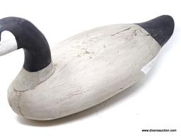 VINTAGE CARVED CANADIAN GOOSE DECOY. SOLID PINE BODY. PAINTED EYES. POSSIBLY MADE BY PAUL GIBSON.