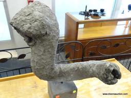 (R1) CEMENT TRUNK-SHAPED SCULPTURE; WITH GREY PLASTER STYLE FINISH. SITS ON CUBIC BASE. MEASURES ~18
