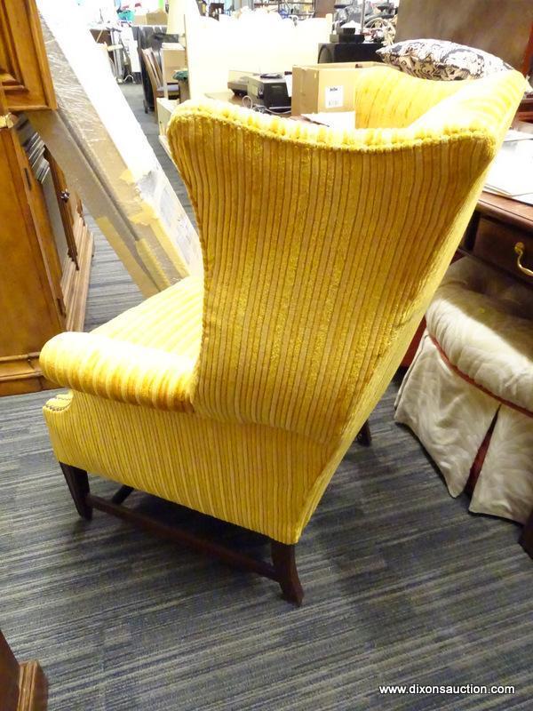 (R1) WING BACK ARM CHAIR; MULTI-TONED YELLOW FABRIC WINGBACK ARMCHAIR WITH NAILHEAD DETAILING. SITS