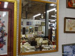 (RWALL) WALL HANGING MIRROR; BEVELED GLASS MIRROR IN A COPPER PAINTED WOODEN FRAME. HAS FLOWER