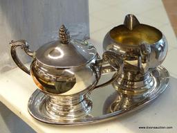 (WINDOW) SILVERPLATE CREAMER AND PITCHER SET; COMES WITH UNDERPLATE AND SCROLL DETAILED HANDLES.