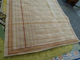 AREA RUG; MODERN, MACHINE WOVEN AREA RUG WITH ORANGE AND CREAM STRIPES AND RED ACCENTS. MEASURES 92