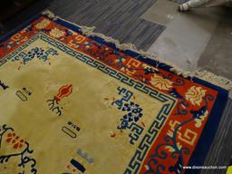 ORIENTAL AREA RUG; CREAM, BLUE, AND RED ORIENTAL AREA RUG WITH A FLORAL PATTERN. HAS A FLORAL