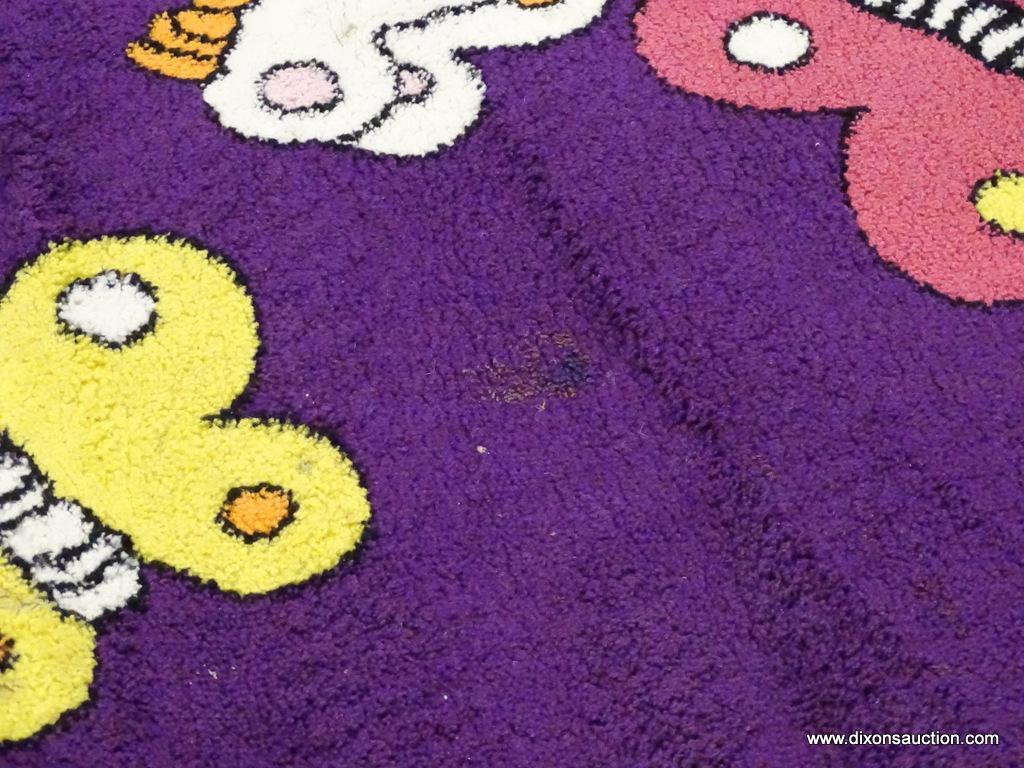 KIDS COLLECTION AREA RUG; HAS A BUTTERFLY PATTER WITH A DARK PURPLE COLOR BASE. BUTTERFLIES AREA