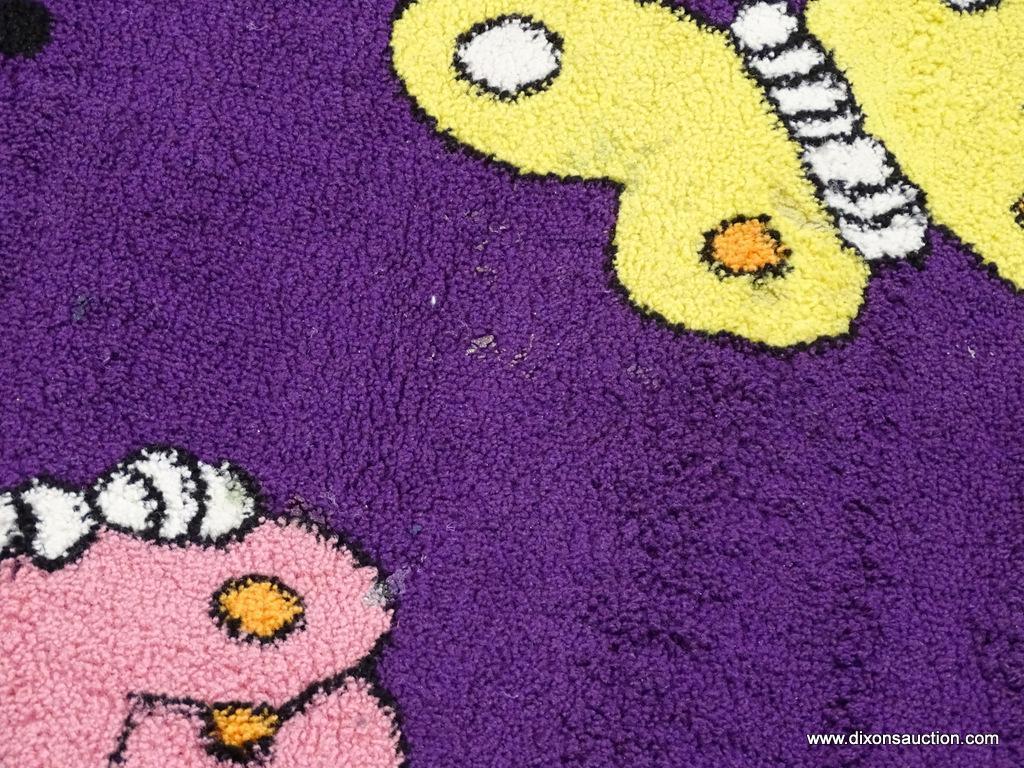 KIDS COLLECTION AREA RUG; HAS A BUTTERFLY PATTER WITH A DARK PURPLE COLOR BASE. BUTTERFLIES AREA