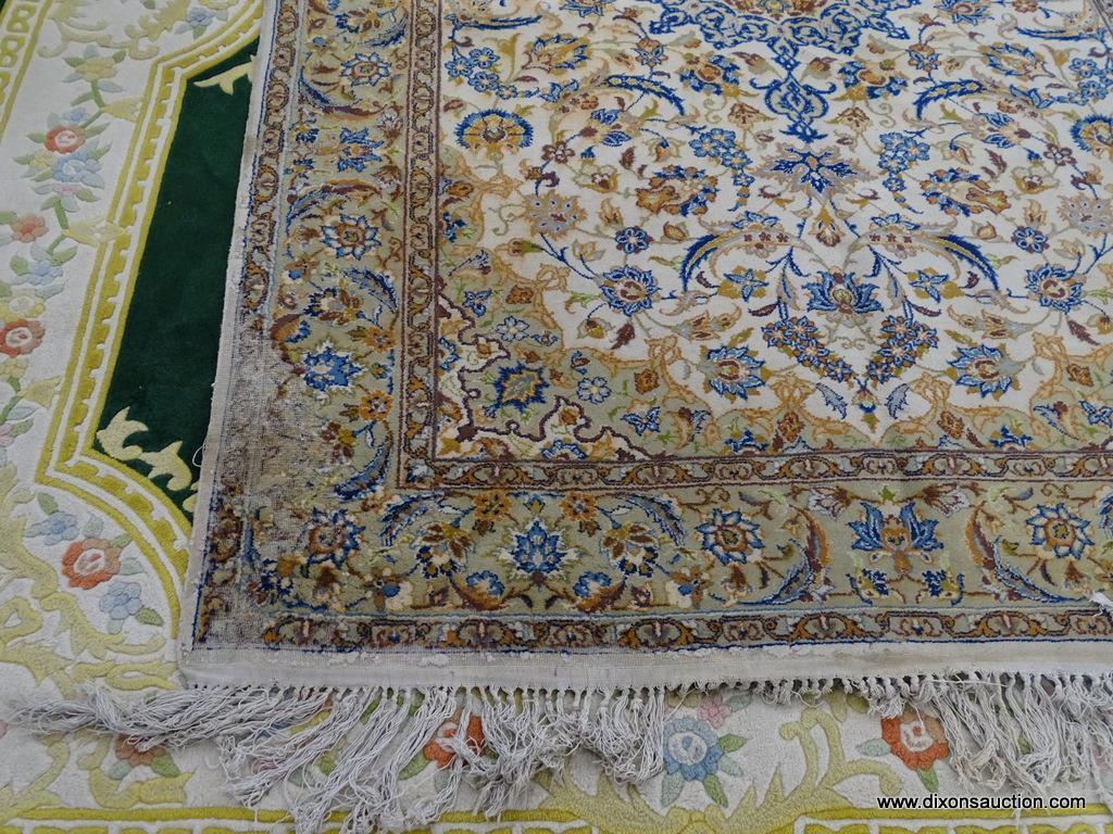 FLORAL AREA RUG; BLUE, BEIGE, AND CREAM AREA RUG WITH A FLORAL PATTERN. HAS A BEIGE COLOR BASE THAT