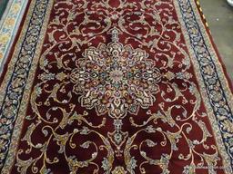 IMPERIAL AREA RUG; HEIRLOOM FLORAL PATTERNED AREA RUG WITH A WINE AND NAVY COLOR. MEASURES 7 FT 8 IN