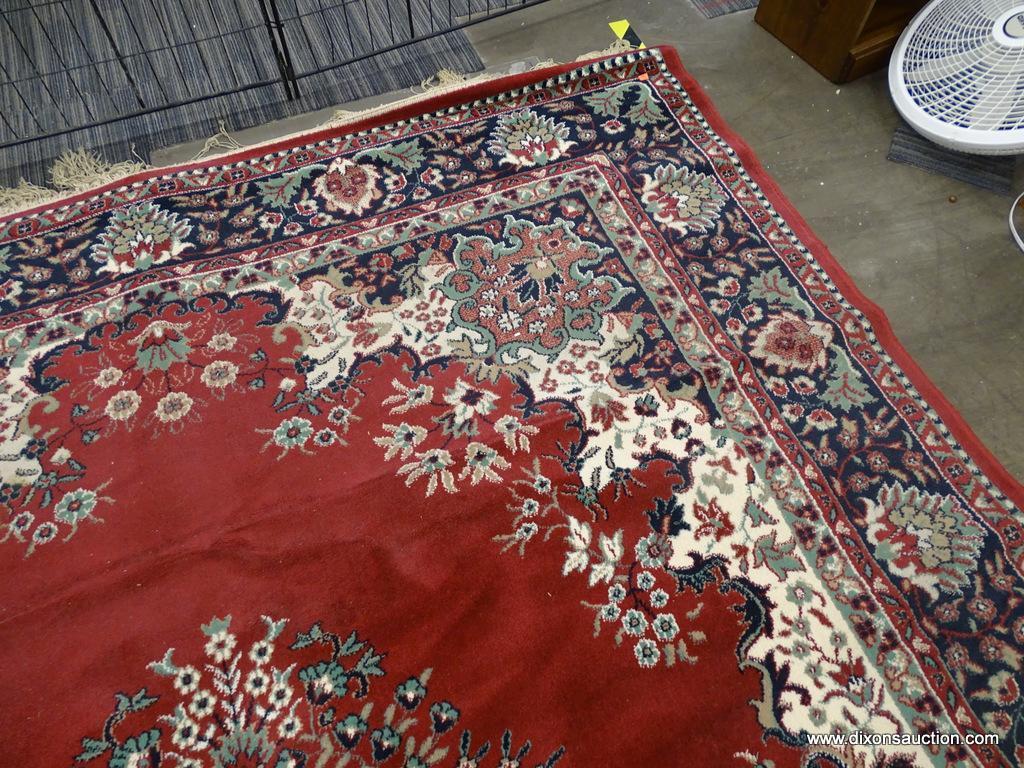 FLORAL AREA RUG; RED, CREAM, NAVY, AND GREEN FLORAL AND LEAF PATTERNED, MACHINE WOVEN AREA RUG WITH