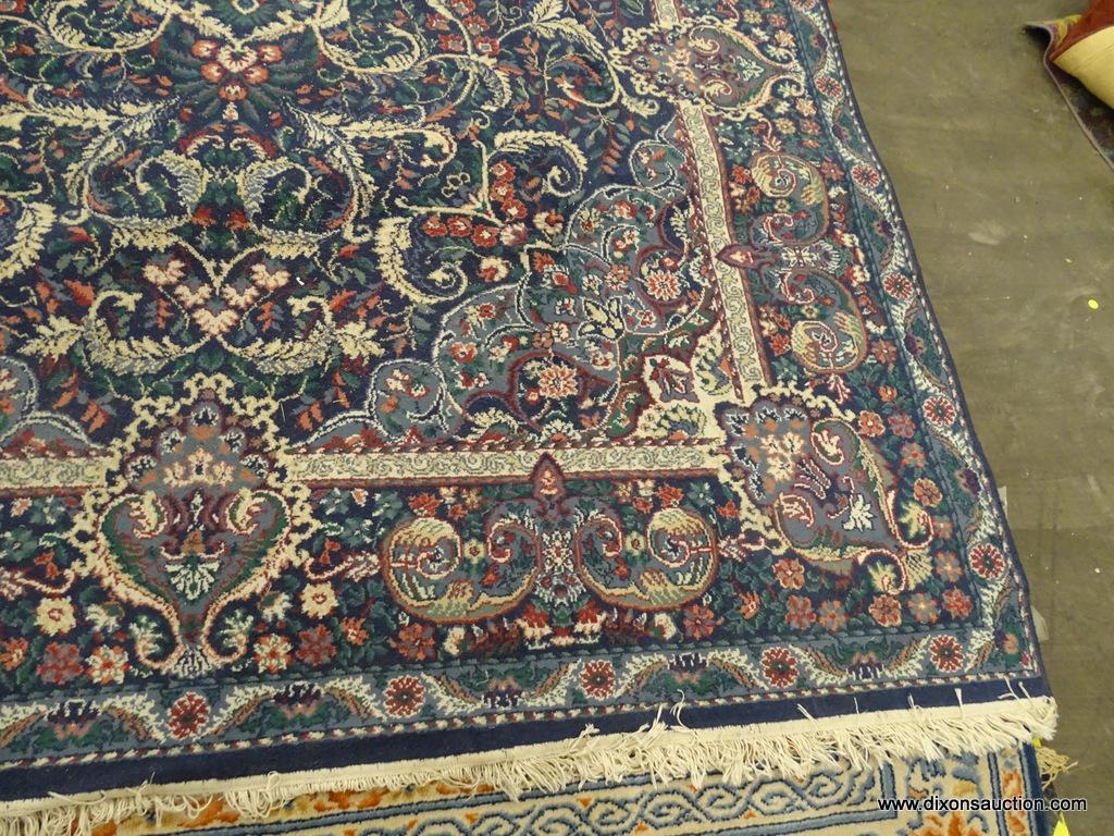 DALYN RUG COMPANY AREA RUG; CLASSICAL LEAVES AREA RUG WITH A NAVY COLOR. HAS FLORAL AND LEAF