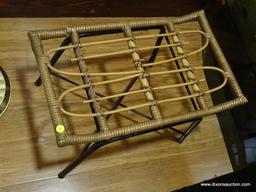 (BDEN) RATTAN BENCH; BLACK METAL BASED BENCH WITH RATTAN TOP. DOES HAVE SOME DAMAGE. MEASURES 1' 10"