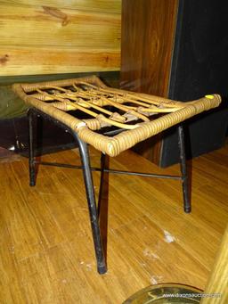 (BDEN) RATTAN BENCH; BLACK METAL BASED BENCH WITH RATTAN TOP. DOES HAVE SOME DAMAGE. MEASURES 1' 10"