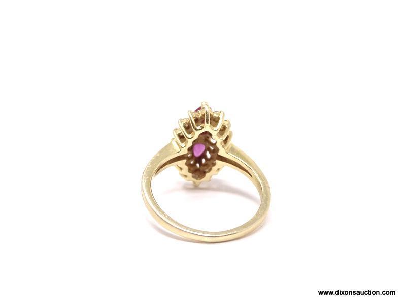 LADIES 14K RUBY AND DIAMOND RING; 14K YELLOW GOLD RING WITH MARQUISE CUT RUBY IN THE CENTER