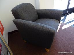 (OFC1) MCM STYLE GREY UPHOLSTERED ARM CHAIRS WITH BLACK PATTERN AND TAPERED NATURAL WOOD GRAIN FEET.